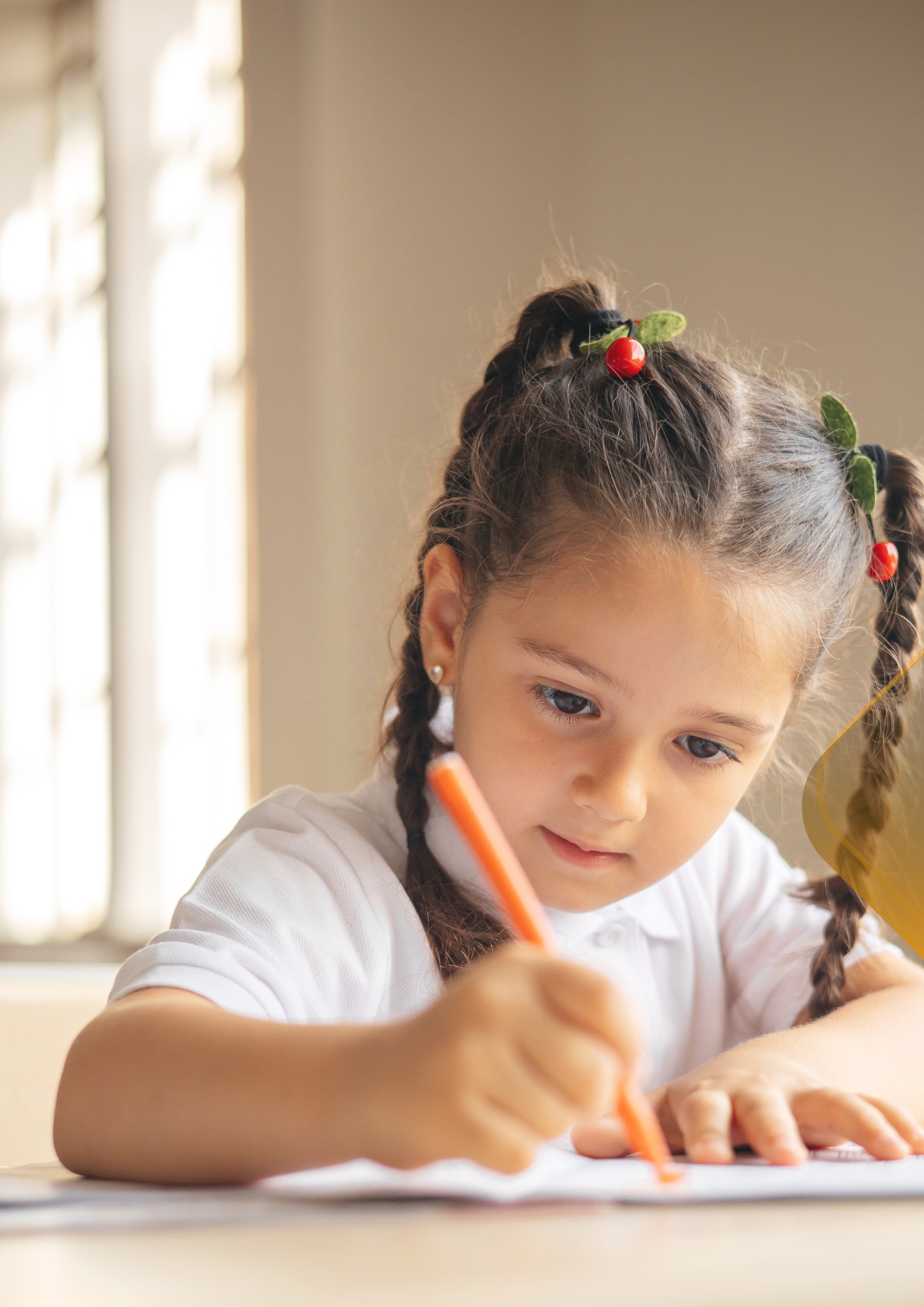 Child focused on creative learning and writing activities